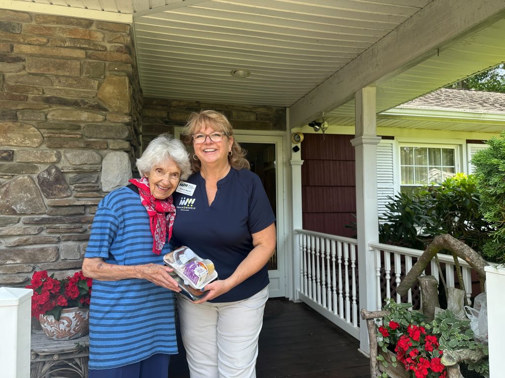Meals on Wheels - Sharon Martini with a client of the organization.
